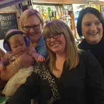 Julie, Lucy and Nat being photobombed by the little one